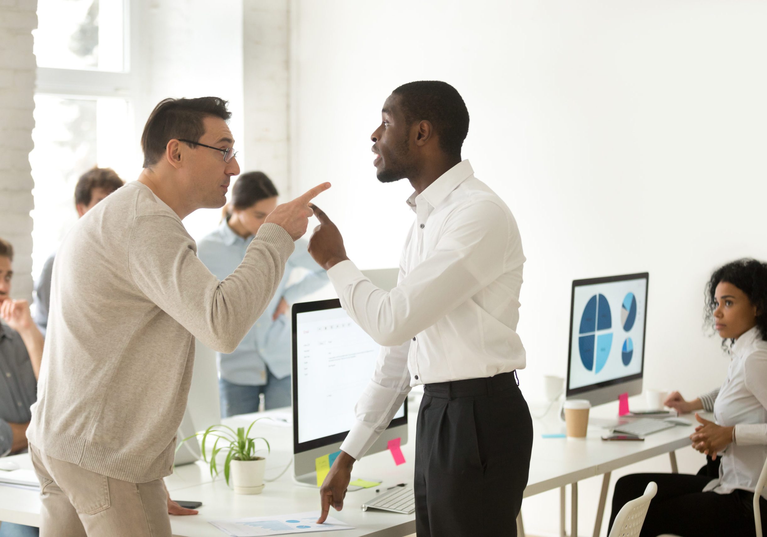 Multiracial african and caucasian colleagues disputing having disagreement at work blaming each other in mistake, diverse coworkers arguing about project, having conflict fight at workplace concept